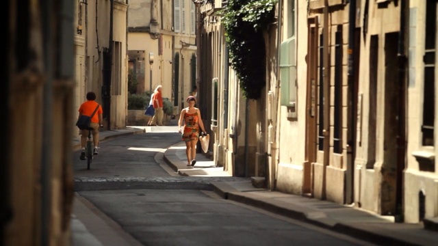 Video Reference: Street, Road, Town, Pedestrian, Lane, Alley, Snapshot, Urban area, Neighbourhood, Infrastructure, Person