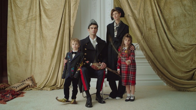 Video Reference: suit, fashion, family, formal wear, ceremony, fun, gentleman, girl, event, Person