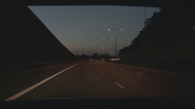 Video Reference: Brown, Sky, Automotive lighting, Road surface, Asphalt, Thoroughfare, Atmospheric phenomenon, Electricity, Street light, Road