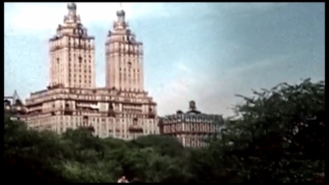 Video Reference: landmark, sky, historic site, metropolis, château, building, city, tourist attraction, medieval architecture, plaza, Person