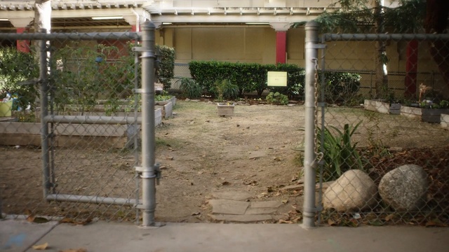 Video Reference: property, fence, residential area, outdoor structure, courtyard, area, yard, house, backyard, real estate