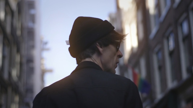 Video Reference: Male, Human, Gentleman, Headgear, Street, Street fashion, Glasses, White-collar worker, Smile, Cap