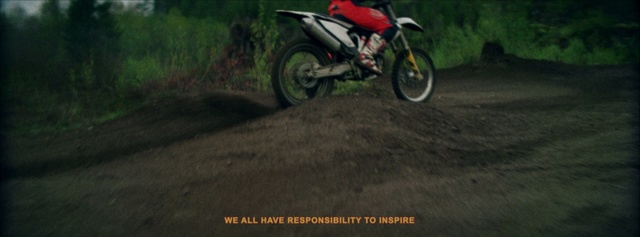 Video Reference: Land vehicle, Vehicle, Motocross, Motorcycle, Freestyle motocross, Motorcycling, Nature, Soil, Extreme sport, Motorcycle racing, Outdoor, Grass, Road, Bicycle, Riding, Parked, Rider, Helmet, Dirt, Man, Scooter, Street, Small, Side, Path, Red, Country, Driving, Yellow, Sitting, Trick, Green, Doing, Wearing, Young, Boy, Hill, Black, Forest, Jumping, Grassy, Ramp, White, Field, Air, Tree, Wheel, Motorbike, Bike, Transport, Enduro, Text, Sports equipment