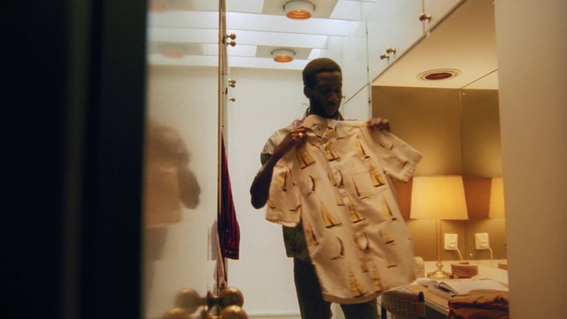 Video Reference: Fashion, Outerwear, Room, Fashion design, Fur, Jacket, Coat, Display window, Beige, Sleeve