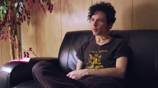 Video Reference: Sitting, Hairstyle, Chin, Human, Black hair, Leg, Furniture, Couch, Mouth, Photography