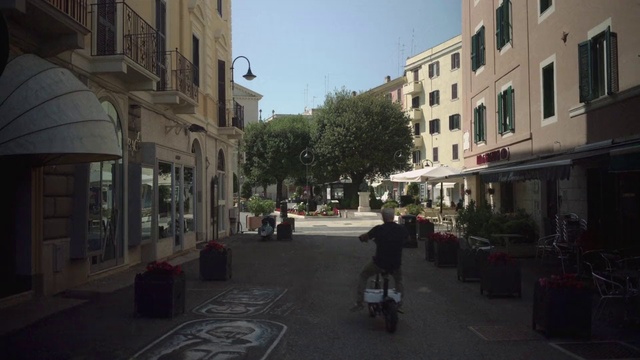 Video Reference: Town, Street, Neighbourhood, Road, Lane, Human settlement, City, Building, Downtown, Infrastructure