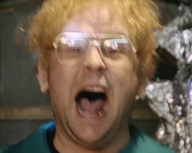 Video Reference: face, facial expression, nose, chin, head, emotion, mouth, glasses, forehead, eye, Person