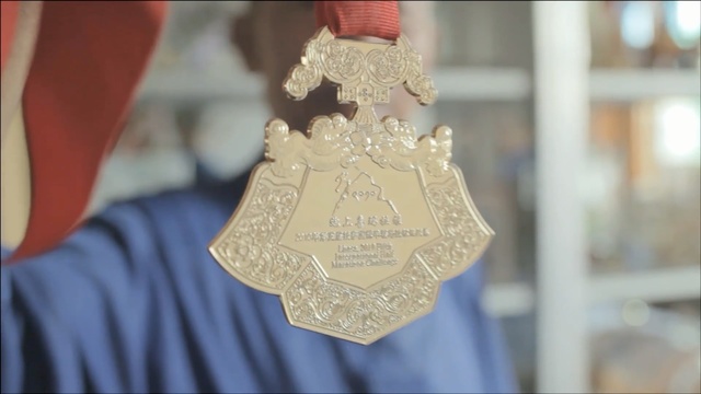 Video Reference: medal, hand, closeup, man