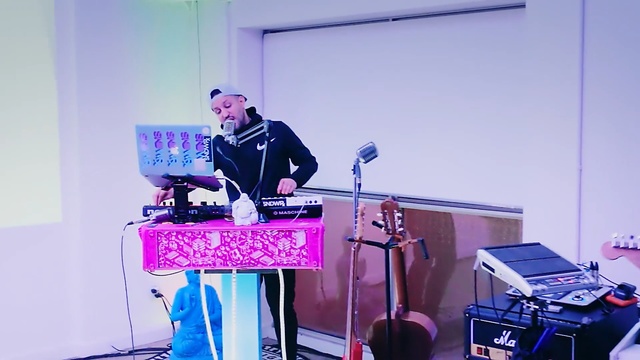 Video Reference: purple, music, technology, performance, entertainment, musician, electronic device, stage, audio, event, Person