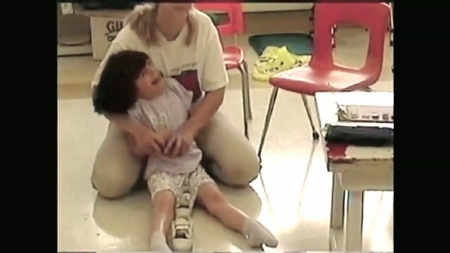 Video Reference: human hair color, leg, mode of transport, girl, snapshot, joint, mouth, sitting, finger, hand, Person