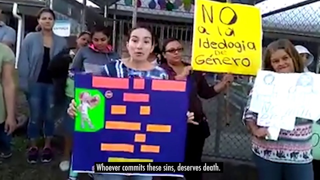 Video Reference: Protest, People, Community, Public event, Event, Crowd, Banner, Advertising, Vehicle registration plate, Automotive exterior