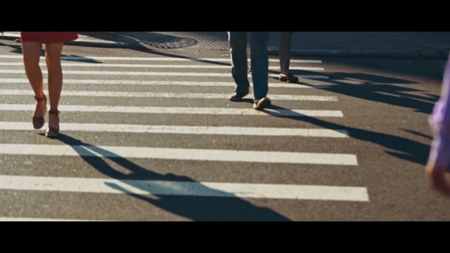 Video Reference: blue, footwear, shadow, photograph, lane, day, infrastructure, shoe, asphalt, pedestrian, Person