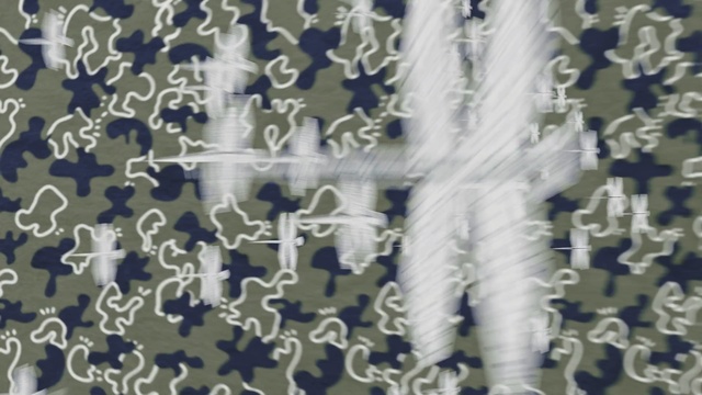 Video Reference: blue, textile, pattern, material, symmetry, font, Person