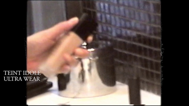 Video Reference: Hair, Finger, Hairstyle, Hand, Long hair, Black hair, Font, Nail, Fur, Hair accessory, Indoor, Person, Window, Man, Using, Front, Woman, Black, Sitting, Phone, Wearing, Table, Holding, Mirror, Food, Computer, Glass, Standing, Kitchen, White, Cat, Text, Bottle