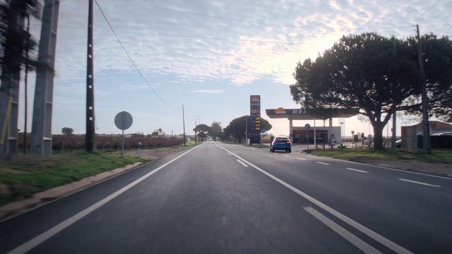 Video Reference: Road, Highway, Asphalt, Lane, Freeway, Thoroughfare, Infrastructure, Road surface, Atmospheric phenomenon, Sky