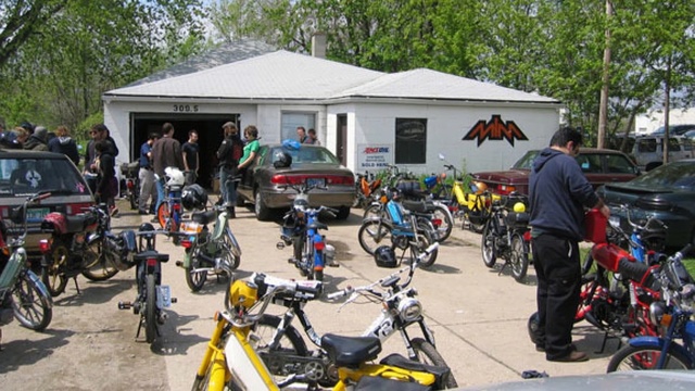 Video Reference: land vehicle, motorcycle, motorcycling, car, vehicle, motor vehicle, tree, racing, adventure, parking, Person