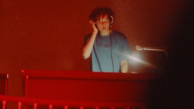 Video Reference: red, performance, singing, darkness, performance art, stage, lighting, music, keyboard player, audio, Person