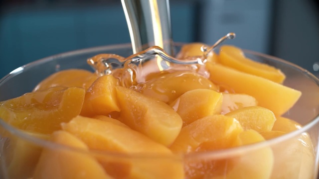 Video Reference: Food, Fruit salad, Dish, Cuisine, Ingredient, Produce, Fruit, Plant, Recipe, Cup, Table, Indoor, Glass, Filled, Orange, Oranges, Banana, Plate, Container, Blender, Bowl, Full, Sitting, Slice, Sliced, Tray, Cut, Counter, Clear, Holding, Pitcher, Lemon, Vegetable, Citrus, Grapefruit, Vegetarian food, Citric acid, Fruit drink, Dessert