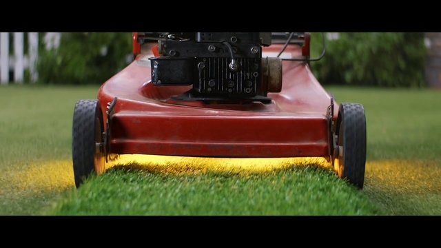 Video Reference: lawn, grass, outdoor power equipment, mower, vehicle, lawn mower, car, plant, asphalt, hardware