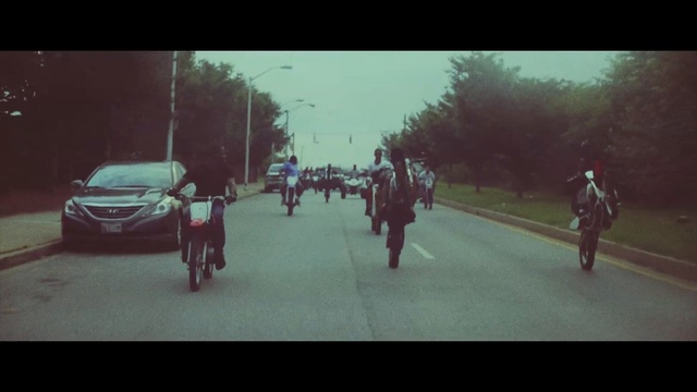 Video Reference: red, car, photograph, green, lane, sky, day, mode of transport, morning, light, Person