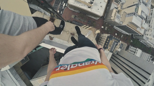 Video Reference: pov, hand, leg, people, shoes, city, skyscraper, cliff, Person