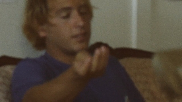 Video Reference: mammal, vertebrate, nose, head, chin, mouth, finger, human, hand, arm, Person