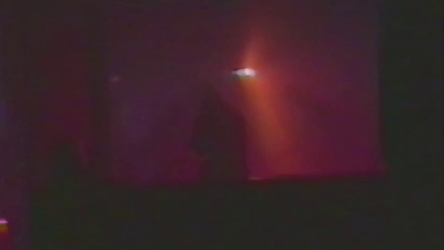 Video Reference: Violet, Light, Purple, Lighting, Darkness, Pink, Magenta, Geological phenomenon, Atmosphere, Night, Red, Laptop, Dark, Sitting, Computer, Monitor, Television, Sign, Room, Table, Close, Screen, Blurry, Lit, Green, Desk, Man, Large, Cat, Mirror, Woman, White, Street, Living, Standing, Concert, Dance, Night sky