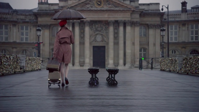 Video Reference: Umbrella, Town, Public space, Architecture, Column, Rain, Material property, Facade, Temple, Street