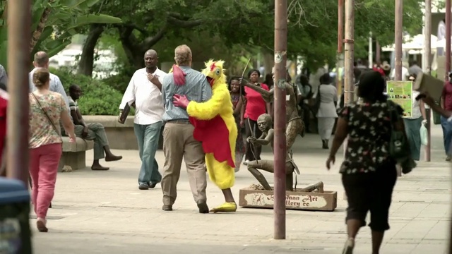 Video Reference: Photograph, People, Pedestrian, Walking, Snapshot, Public space, Yellow, Fun, Community, Street