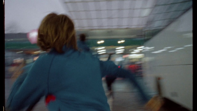 Video Reference: Sleeve, Fun, Electric blue, Glass, City, Crowd, T-shirt, Public transport, Sitting, Recreation