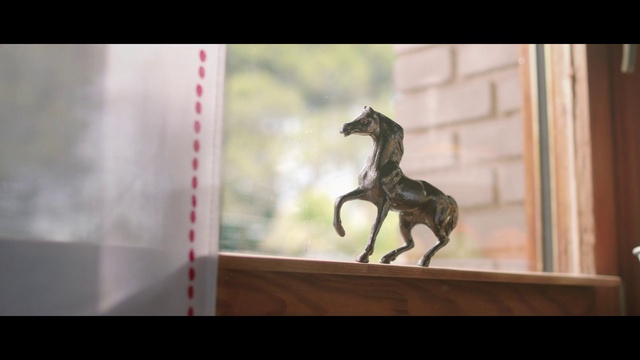 Video Reference: Horse, Toy, Sculpture, Working animal, Wood, Fawn, Rectangle, Horse supplies, Pack animal, Font