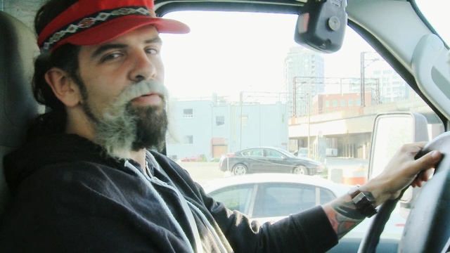 Video Reference: car, mode of transport, facial hair, vehicle, beard, motor vehicle, driving, automotive exterior, city car, glass