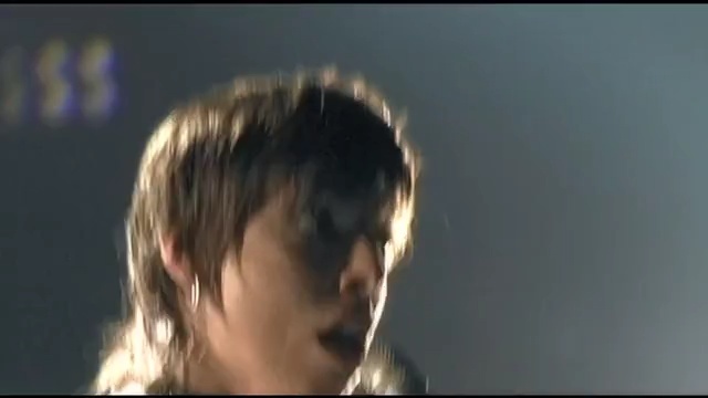 Video Reference: Head, Nose, Chin, Forehead, Human, Jaw, Scene, Singer, Fictional character, Black hair