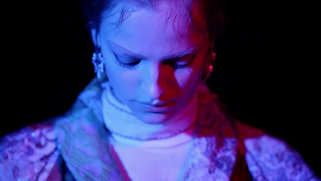 Video Reference: Face, Blue, Purple, Violet, Head, Light, Forehead, Human, Electric blue, Eye, Person