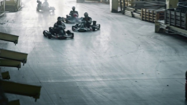 Video Reference: Floor, Vehicle, Kart racing, Flooring, Go-kart, Tile, Automotive tire, Sitting, Street, Car