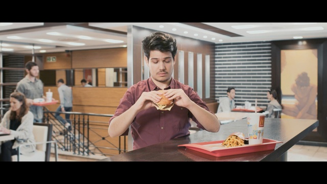 Video Reference: mcdonalds, man, burger, eating, table, Person