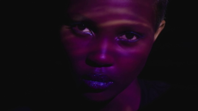 Video Reference: Face, Purple, Violet, Black, Head, Light, Beauty, Nose, Darkness, Pink