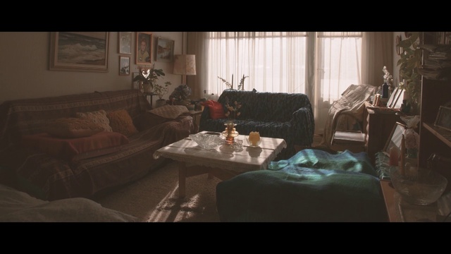 Video Reference: Living room, Room, Couch, Furniture, Snapshot, Screenshot, Interior design, Table, Textile, Pc game