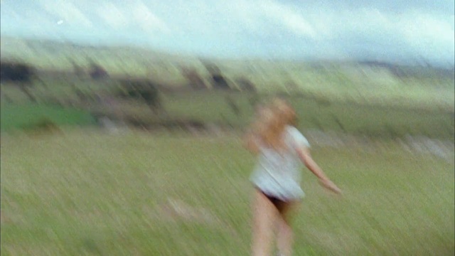Video Reference: grassland, ecosystem, grass, sky, prairie, steppe, ecoregion, hill, girl, meadow