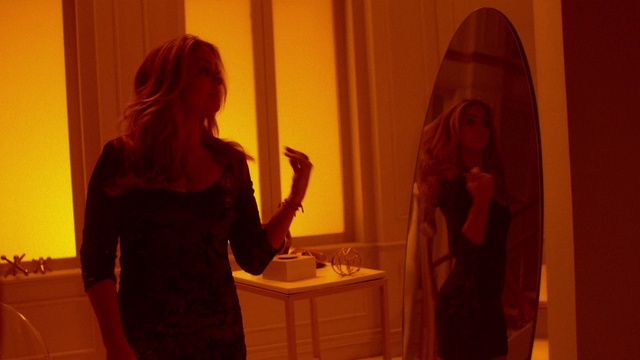 Video Reference: Red, Orange, Room, Fun, Long hair, Photography, Art, Person, Indoor, Standing, Woman, Front, Man, Holding, Mirror, Girl, Looking, Young, Door, Video, White, Playing, Table, Sink, Wall, Clothing, Human face, Curtain