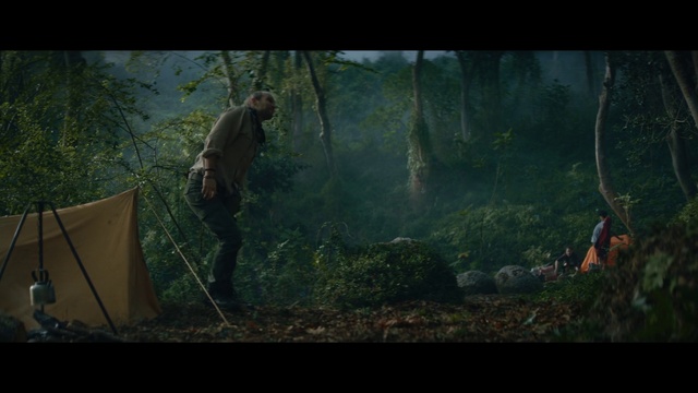 Video Reference: Nature, Natural environment, Forest, Woodland, Jungle, Wilderness, Tree, Screenshot, Old-growth forest, Pc game, Person, Man, Grass, Tent, Standing, Holding, Young, Boy, Green, Board, Riding, Flying, Field, Umbrella, Water, Doing, Kite, Air, Cat, Trick, Fantasy, Video game, Hiking, Text, Fog, Outdoor object