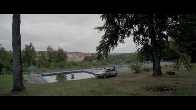Video Reference: Nature, Tree, Natural environment, Morning, Atmospheric phenomenon, Biome, Rural area, Sky, Waterway, Landscape, Outdoor, Grass, Small, Street, Side, Parked, Sitting, Road, Driving, White, Water, Forest, Plane, Field, Red, Sign, River, Motorcycle, Vehicle, Land vehicle, Car, Text, Cloud, Wheel