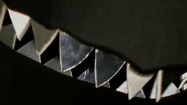 Video Reference: Automotive design, Triangle, Automotive exterior, Tints and shades, Art, Font, Pattern, Metal, Composite material, Fixture