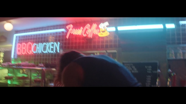 Video Reference: Light, Neon, Visual effect lighting, Display device, Electronic signage, Fun, Technology, Neon sign, Lens flare, Signage, Television, Screen, Monitor, Person, Man, Looking, Front, Blurry, Sitting, Holding, Woman, Video, Bus, Room, Standing, Phone, People, Cat, Playing, Red, Living, Remote, Food, Game, Clock, City, Computer, Train, Street, Text, Screenshot, Display