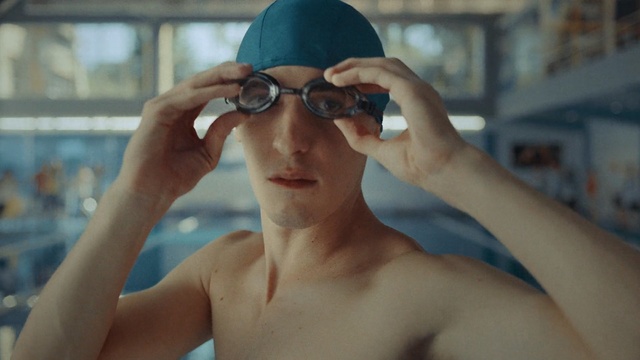 Video Reference: eyewear, sunglasses, glasses, swimmer, vision care, cool, muscle, fun, goggles, barechestedness, Person
