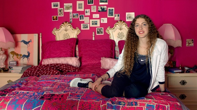 Video Reference: Pink, Bedroom, Room, Red, Magenta, Bed sheet, Textile, Linens, Furniture, Bedding, Person