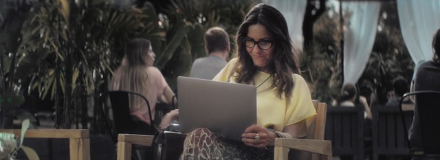 Video Reference: Eyewear, Glasses, Adaptation, Sitting, Tree, Reading, Conversation, Event, Vision care, Electronic device, Person, Laptop, Outdoor, Woman, Computer, Chair, Table, Looking, Front, Man, Using, Holding, People, White, Young, Bench, Large, Human face, Clothing, Smile