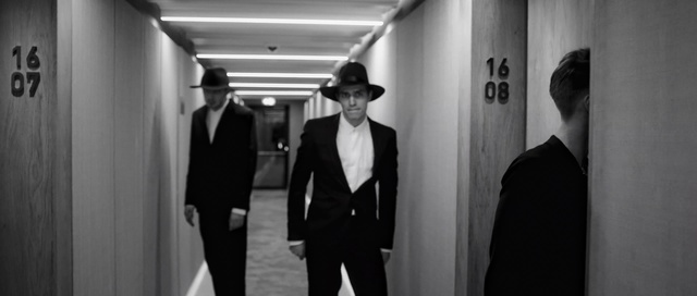 Video Reference: Photograph, Suit, White, Standing, Formal wear, Monochrome photography, Black-and-white, Snapshot, Monochrome, Photography