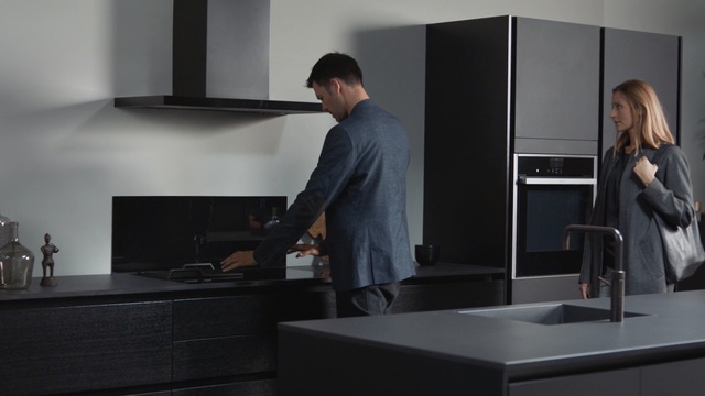 Video Reference: furniture, room, interior design, kitchen, home appliance, product, desk, kitchen appliance, Person