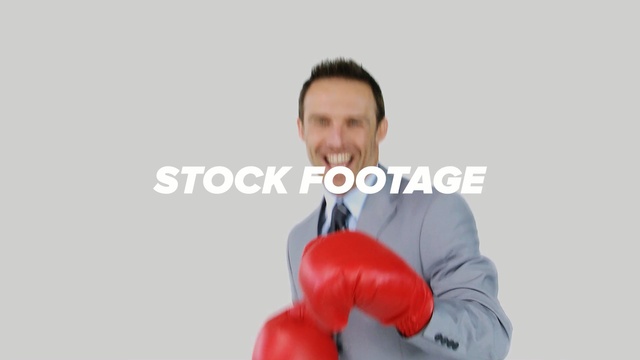 Video Reference: boxing equipment, shoulder, boxing glove, megaphone, arm, neck, microphone, Person